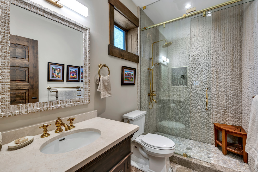 Bathroom - mid-sized rustic beige tile and ceramic tile ceramic tile and brown floor bathroom idea in Other with furniture-like cabinets, brown cabinets, a one-piece toilet, beige walls, an undermount sink and granite countertops