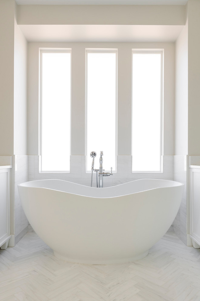 Inspiration for a large contemporary ensuite bathroom in Salt Lake City with freestanding cabinets, white cabinets, a freestanding bath, a one-piece toilet, white tiles, cement tiles, white walls, cement flooring, an integrated sink, granite worktops, white floors, an open shower and white worktops.
