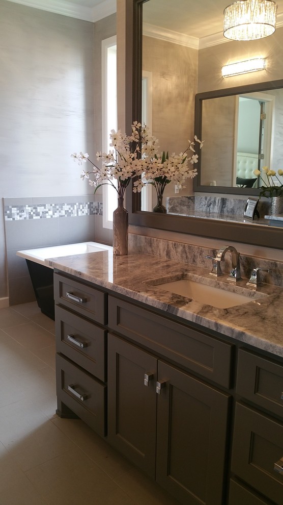 Inspiration for a large transitional master gray tile, white tile and mosaic tile porcelain tile and beige floor bathroom remodel in Other with shaker cabinets, gray walls, an undermount sink, brown cabinets and granite countertops