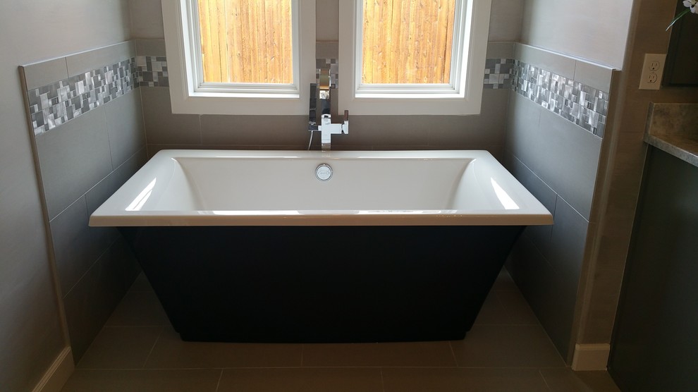 Photo of a large traditional ensuite bathroom in Other with shaker cabinets, grey cabinets, a freestanding bath, an alcove shower, grey tiles, white tiles, mosaic tiles, grey walls, porcelain flooring, a submerged sink and marble worktops.