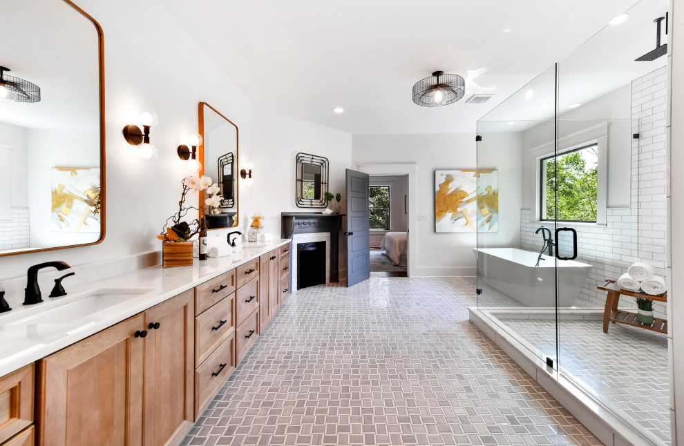 Bathroom - huge transitional master white tile porcelain tile, gray floor and double-sink bathroom idea in Atlanta with light wood cabinets, white walls, an undermount sink, marble countertops, a hinged shower door, white countertops, a built-in vanity and recessed-panel cabinets