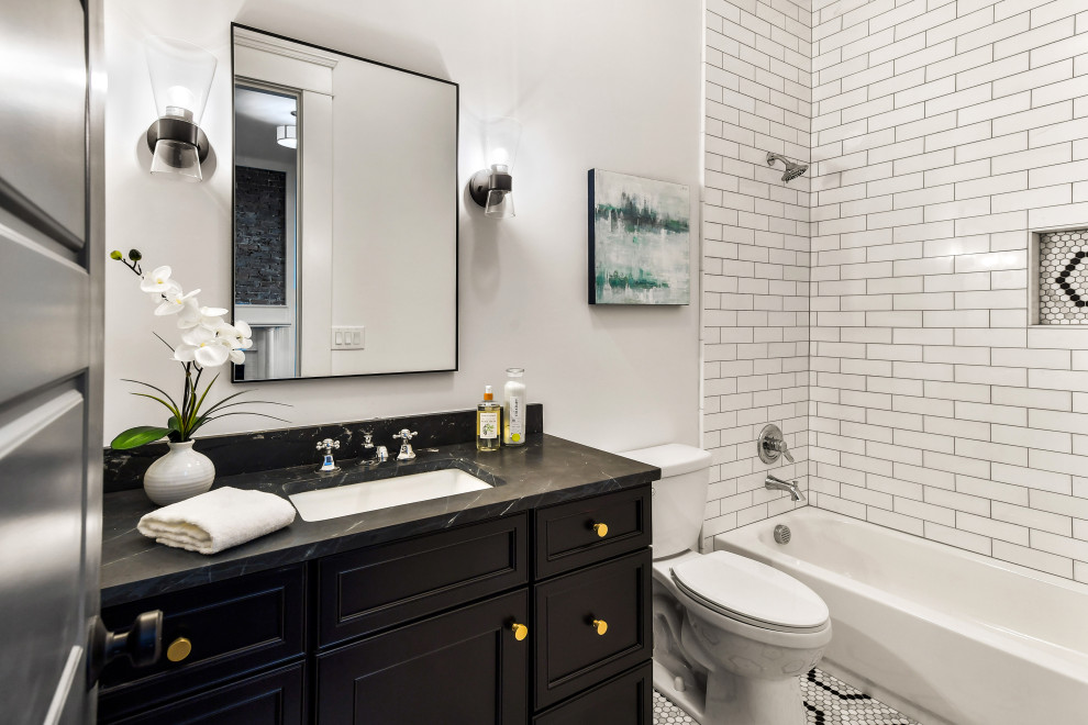 Inspiration for a transitional 3/4 white tile and subway tile mosaic tile floor, multicolored floor and single-sink bathroom remodel in Atlanta with recessed-panel cabinets, black cabinets, a two-piece toilet, white walls, an undermount sink, black countertops, a niche and a built-in vanity