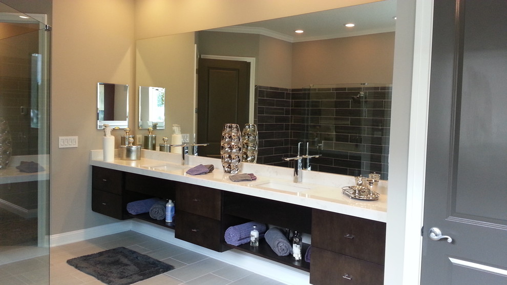 Bathroom - contemporary bathroom idea in Jacksonville with an undermount sink, dark wood cabinets and quartz countertops