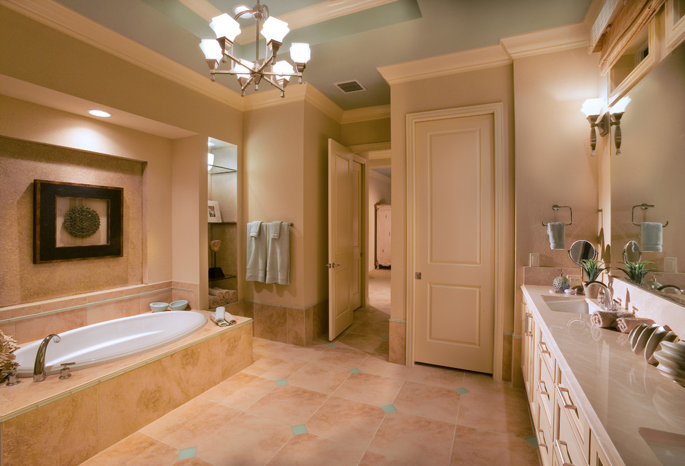 Huge island style master multicolored tile porcelain tile bathroom photo in Tampa with an undermount sink, flat-panel cabinets, light wood cabinets, marble countertops, a two-piece toilet and beige walls