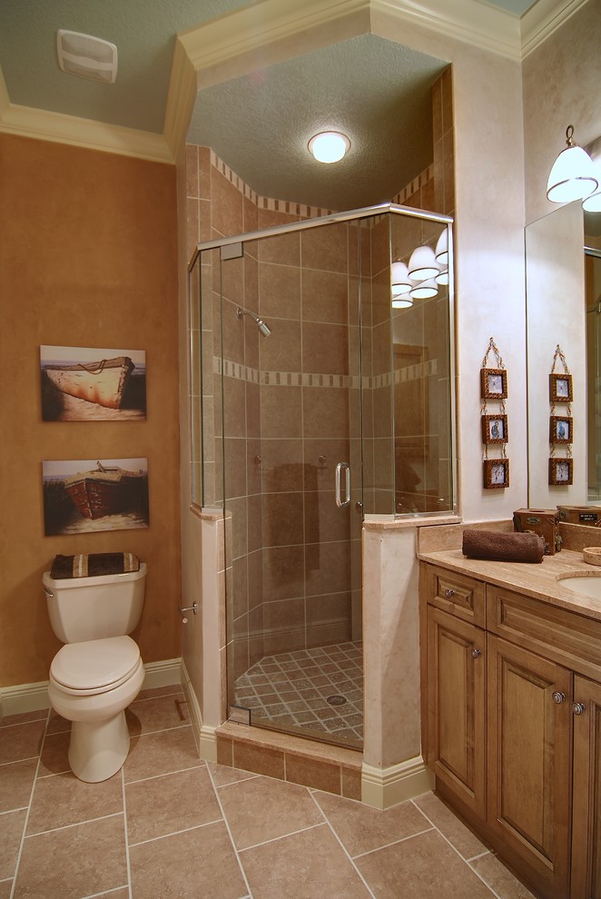 Example of a huge island style kids' beige tile and porcelain tile porcelain tile corner shower design in Tampa with an undermount sink, flat-panel cabinets, light wood cabinets, granite countertops, a two-piece toilet and beige walls