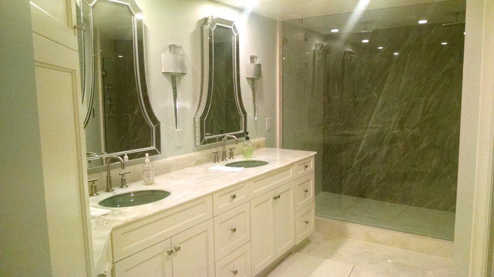 This is an example of a medium sized traditional ensuite bathroom in Miami with a submerged sink, recessed-panel cabinets, white cabinets, marble worktops, a built-in shower, ceramic tiles, porcelain flooring and white walls.