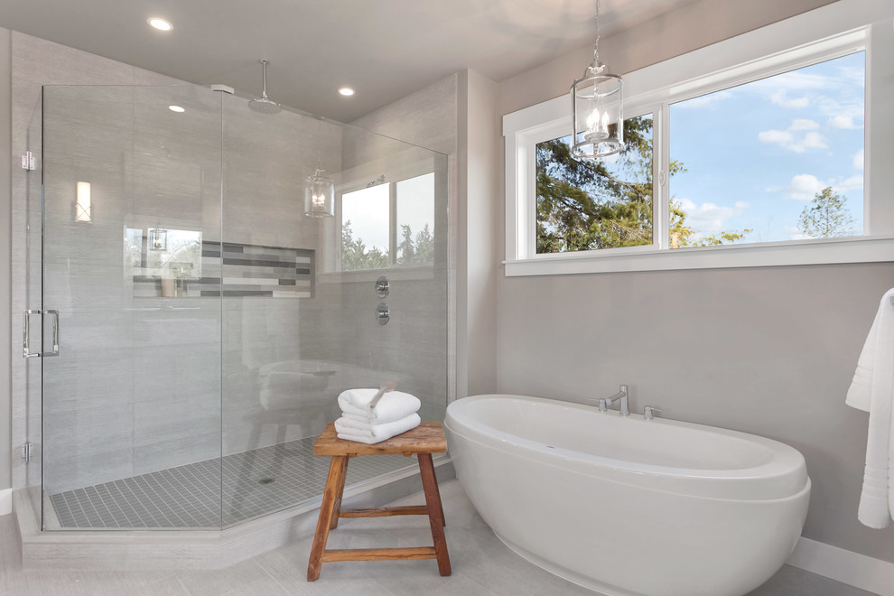 Photo of a large contemporary ensuite bathroom in Seattle with shaker cabinets, light wood cabinets, a freestanding bath, a corner shower, a one-piece toilet, a vessel sink, engineered stone worktops, a hinged door and white worktops.
