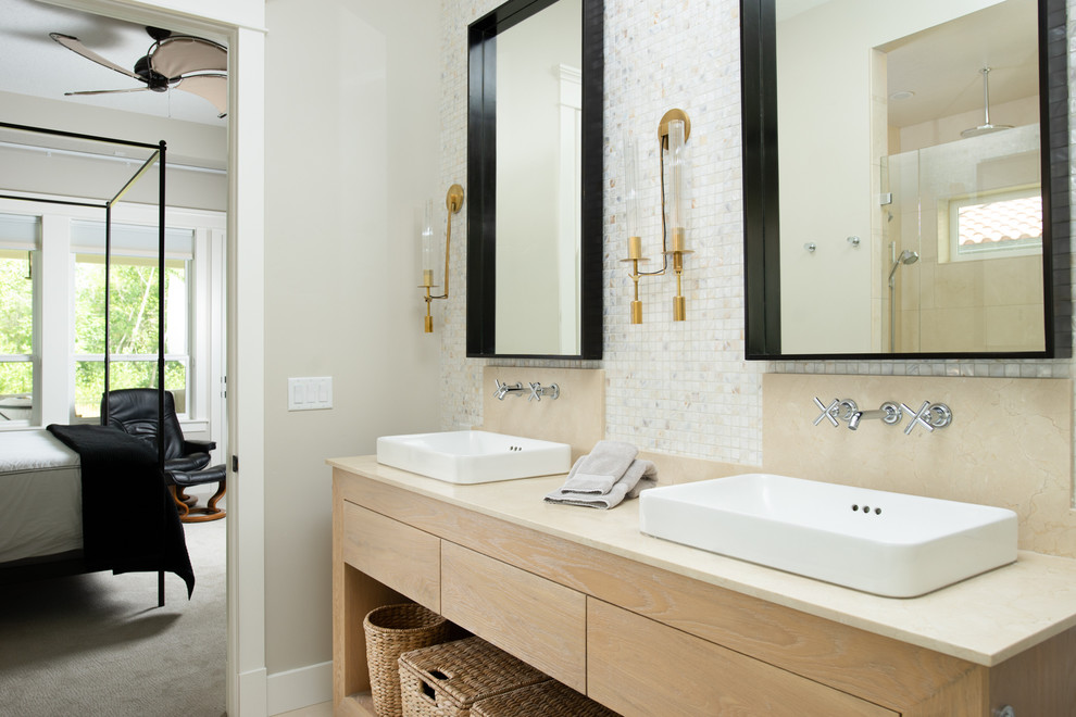 Bathroom - coastal master multicolored tile and mosaic tile bathroom idea in Boise with flat-panel cabinets, light wood cabinets, beige walls, a vessel sink and beige countertops