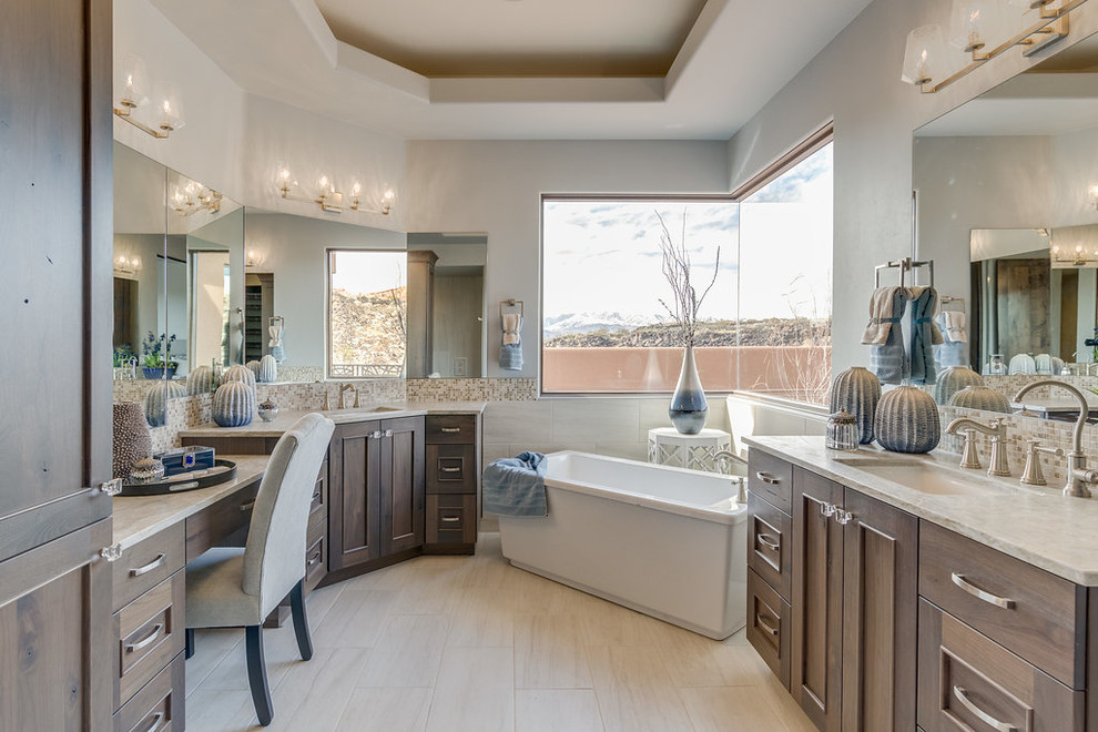 На фото: главная ванная комната в стиле неоклассика (современная классика) с фасадами с утопленной филенкой, темными деревянными фасадами, отдельно стоящей ванной, разноцветной плиткой, плиткой мозаикой, серыми стенами, врезной раковиной и бежевым полом
