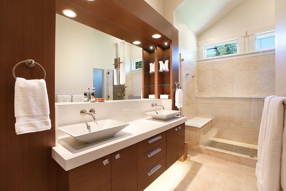 Design ideas for a large modern ensuite bathroom in Salt Lake City with flat-panel cabinets, medium wood cabinets, an alcove shower, white tiles, stone slabs, white walls, porcelain flooring, a vessel sink and engineered stone worktops.