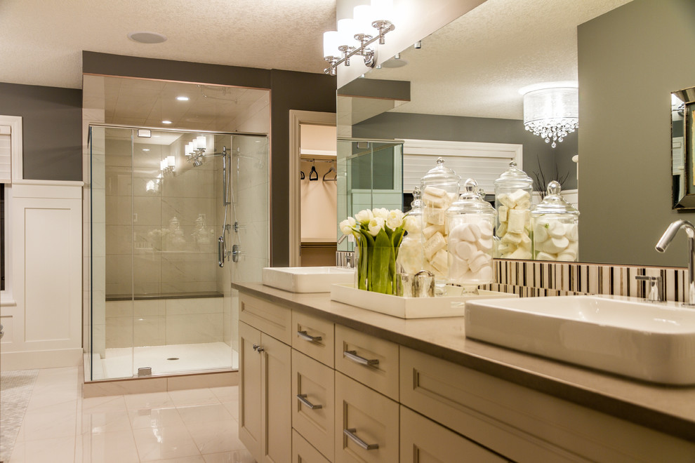Example of a large transitional master porcelain tile bathroom design in Calgary with a vessel sink, recessed-panel cabinets, white cabinets, quartz countertops and brown walls