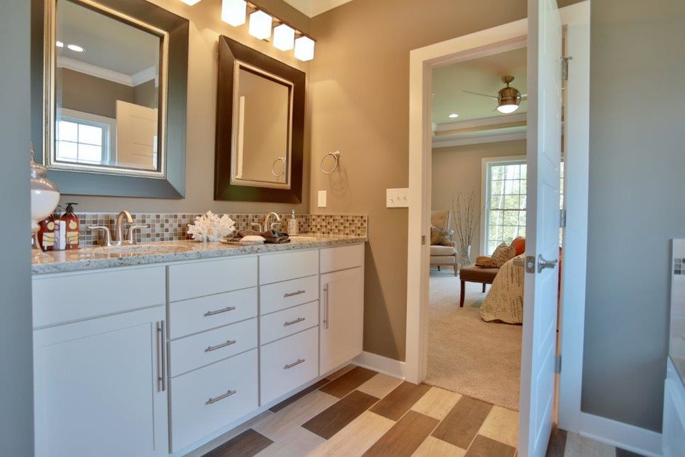 Inspiration for a medium sized traditional ensuite bathroom in Louisville with a submerged sink, shaker cabinets, white cabinets, granite worktops, a built-in bath, a corner shower, ceramic tiles, grey walls, ceramic flooring and a one-piece toilet.