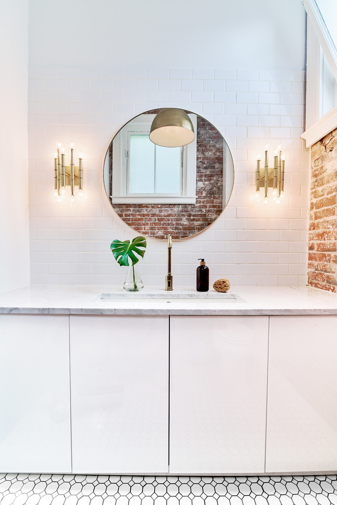 Inspiration for a medium sized scandinavian ensuite bathroom in Providence with flat-panel cabinets, white cabinets, white tiles, metro tiles, white walls, ceramic flooring, a submerged sink, engineered stone worktops, white floors and white worktops.
