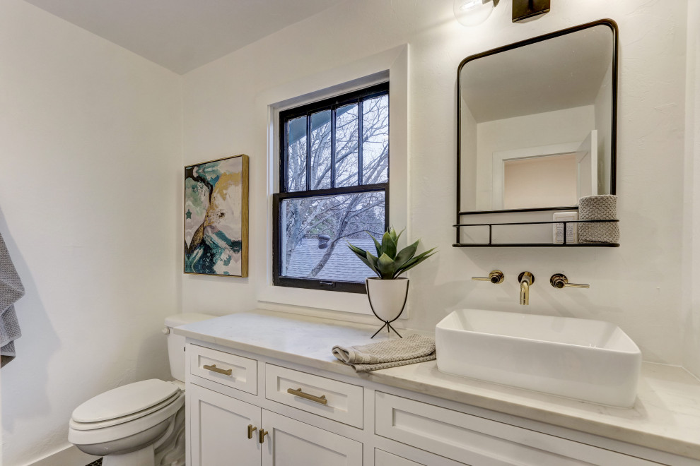 This is an example of a medium sized classic family bathroom in Oklahoma City with flat-panel cabinets, white cabinets, a claw-foot bath, a shower/bath combination, a two-piece toilet, white tiles, ceramic tiles, white walls, ceramic flooring, a submerged sink, engineered stone worktops, black floors, a shower curtain and white worktops.