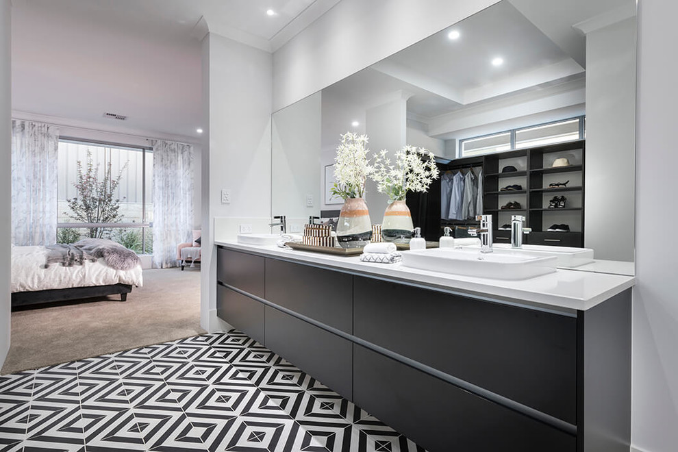 Example of a large trendy master white tile porcelain tile and white floor bathroom design in Perth with flat-panel cabinets, black cabinets, a one-piece toilet, white walls, a drop-in sink, quartz countertops and a hinged shower door