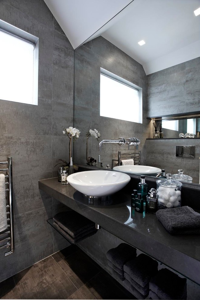 Inspiration for a contemporary bathroom in London with a vessel sink.