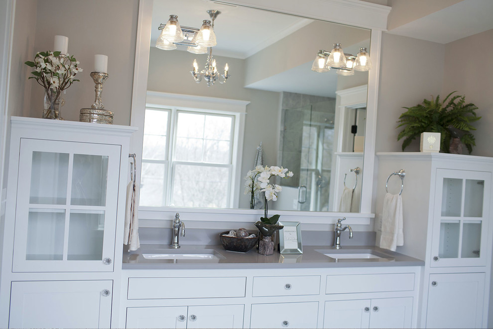 Example of a large transitional master bathroom design in Minneapolis with white cabinets, beige walls and an undermount sink