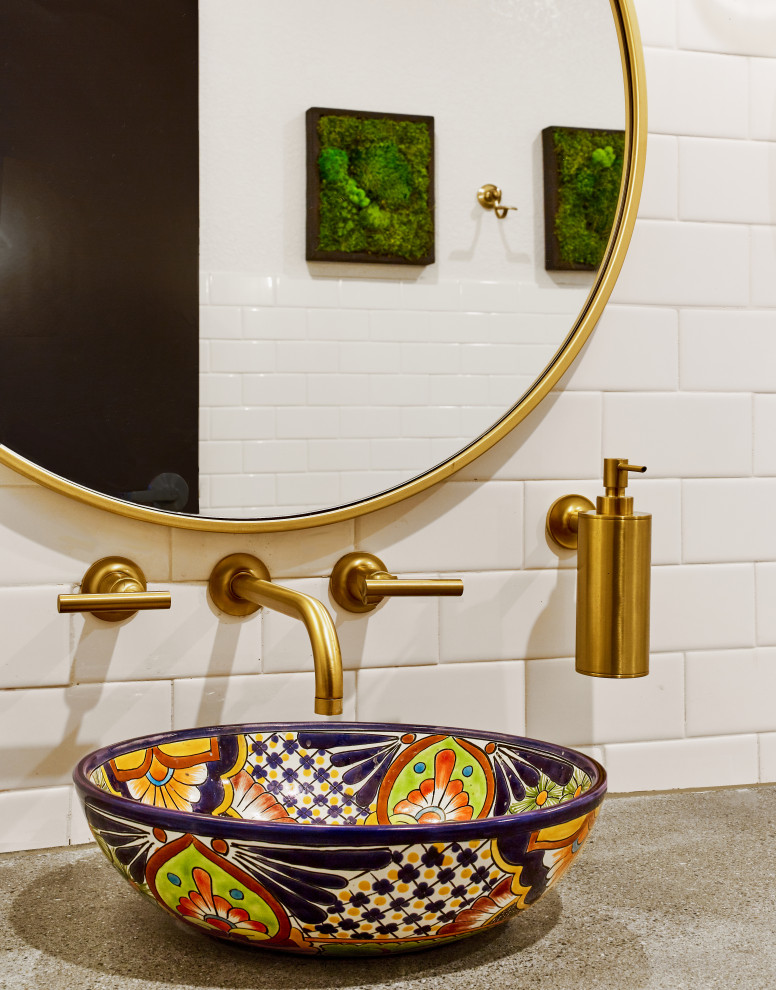 Inspiration for a mid-sized mediterranean white tile and subway tile ceramic tile and brown floor bathroom remodel in Orange County with open cabinets, medium tone wood cabinets, a two-piece toilet, white walls, a vessel sink, concrete countertops and gray countertops