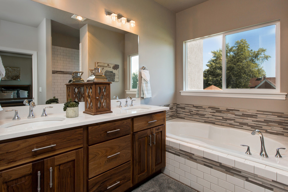 Mid-sized arts and crafts master gray tile and ceramic tile ceramic tile bathroom photo in Salt Lake City with an undermount sink, raised-panel cabinets, medium tone wood cabinets, quartzite countertops, a two-piece toilet and white walls
