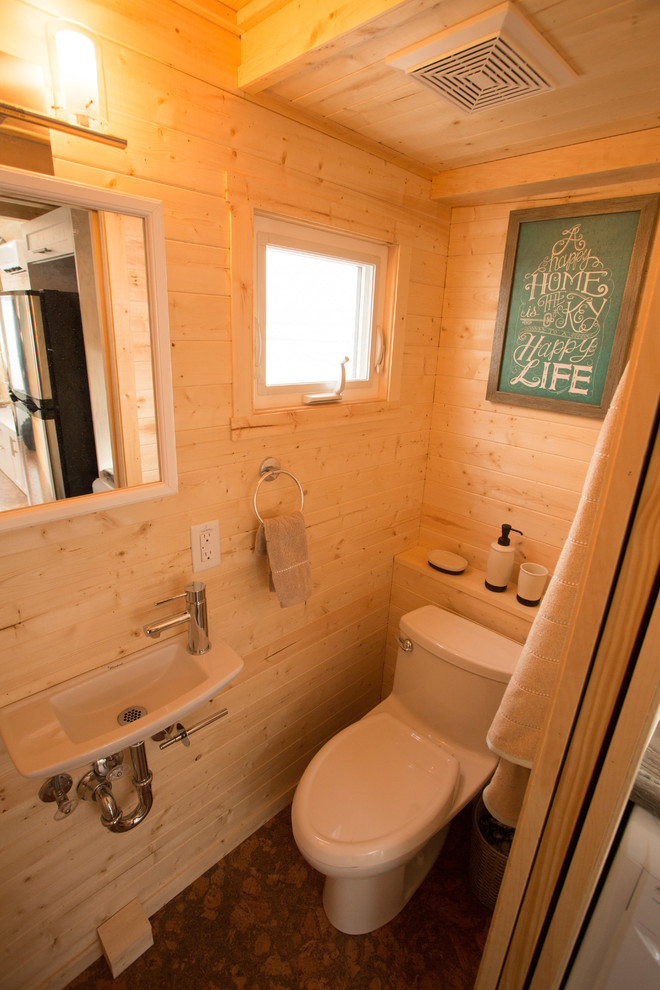 Inspiration for a small craftsman cork floor alcove shower remodel in Other with a two-piece toilet, brown walls, a wall-mount sink and laminate countertops