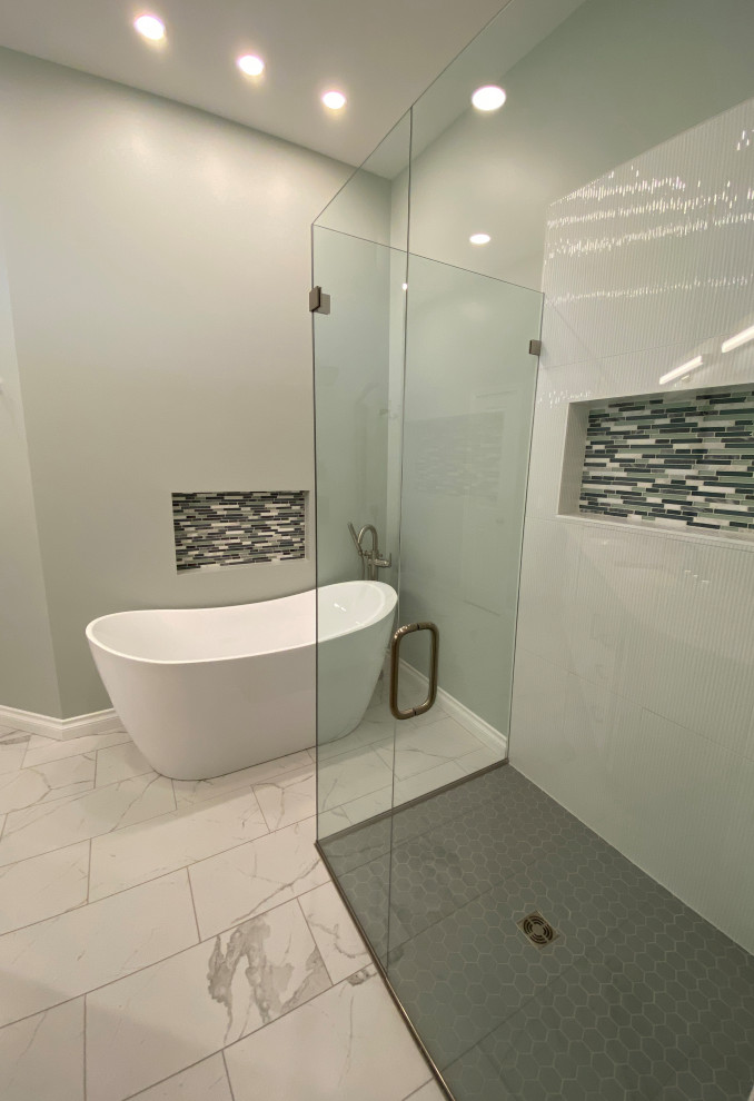 Example of a large transitional master white tile and ceramic tile ceramic tile and white floor bathroom design in Detroit with shaker cabinets, white cabinets, a two-piece toilet, green walls, an undermount sink, granite countertops, a hinged shower door and brown countertops