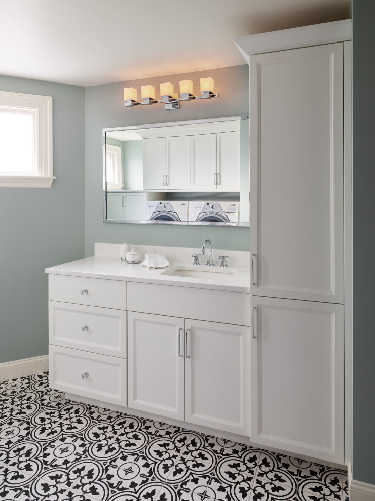 Example of a mid-sized transitional mosaic tile floor, multicolored floor and single-sink bathroom/laundry room design in Boston with recessed-panel cabinets, white cabinets, an undermount sink, white countertops, a built-in vanity and blue walls