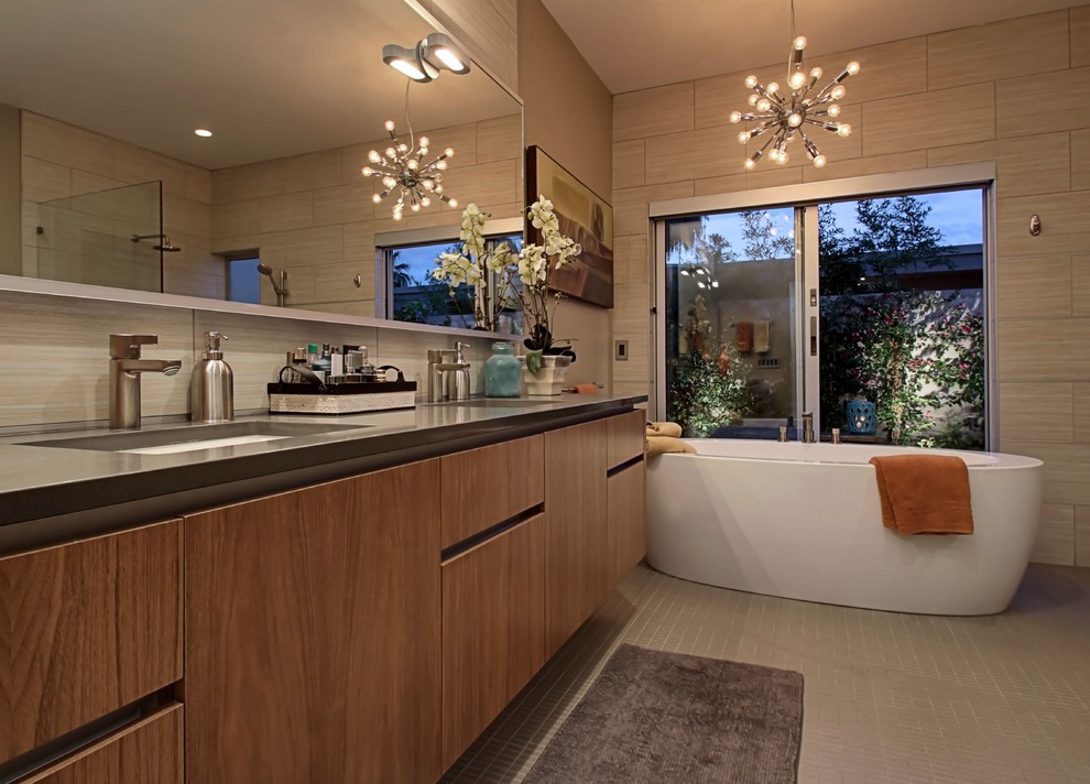 Inspiration for a large 1960s beige tile bathroom remodel in Other with flat-panel cabinets, light wood cabinets, a one-piece toilet and beige walls