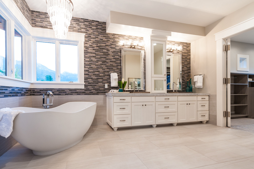 Inspiration for a mid-sized transitional master multicolored tile and ceramic tile ceramic tile bathroom remodel in Salt Lake City with shaker cabinets, white cabinets, a two-piece toilet, white walls and marble countertops
