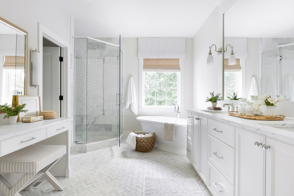 Beach style master white tile white floor bathroom photo in Minneapolis with recessed-panel cabinets, white cabinets, white walls, an undermount sink, a hinged shower door and white countertops