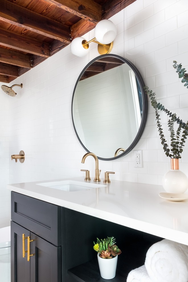 Inspiration for a cottage white tile and subway tile bathroom remodel in Austin with shaker cabinets, black cabinets and an undermount sink