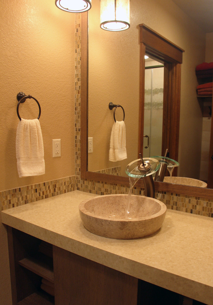 Photo of a medium sized bohemian bathroom in Milwaukee with flat-panel cabinets, medium wood cabinets, engineered stone worktops and glass tiles.