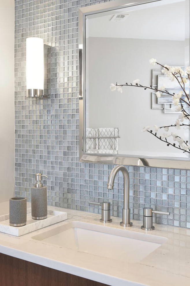 Inspiration for a large modern master gray tile and mosaic tile ceramic tile corner shower remodel in Atlanta with flat-panel cabinets, medium tone wood cabinets, a two-piece toilet, gray walls, an undermount sink and limestone countertops