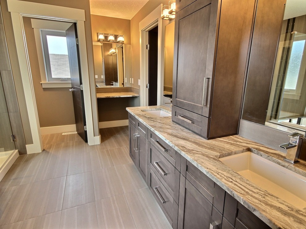 This is an example of a medium sized contemporary ensuite bathroom in Edmonton with shaker cabinets and granite worktops.
