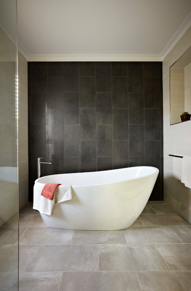Mid-sized trendy master beige tile and ceramic tile ceramic tile freestanding bathtub photo in Sydney with a vessel sink, flat-panel cabinets, brown cabinets, quartz countertops, a one-piece toilet and brown walls