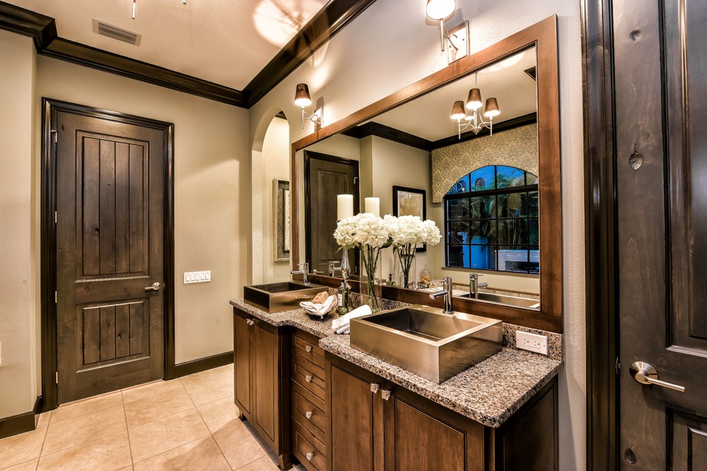 Large contemporary ensuite bathroom in Tampa with flat-panel cabinets, dark wood cabinets, a built-in bath, a corner shower, a two-piece toilet, beige tiles, porcelain tiles, beige walls, porcelain flooring, a trough sink and granite worktops.
