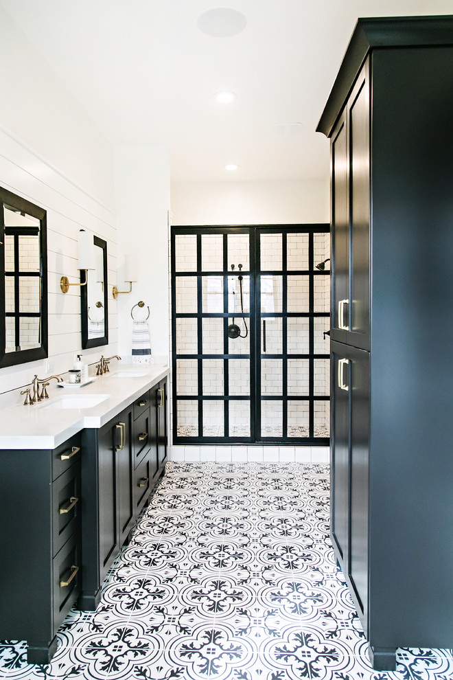 Large rural ensuite bathroom in Salt Lake City with shaker cabinets, black cabinets, an alcove shower, white tiles, metro tiles, multi-coloured walls, cement flooring, a submerged sink, engineered stone worktops, white floors, a hinged door and white worktops.