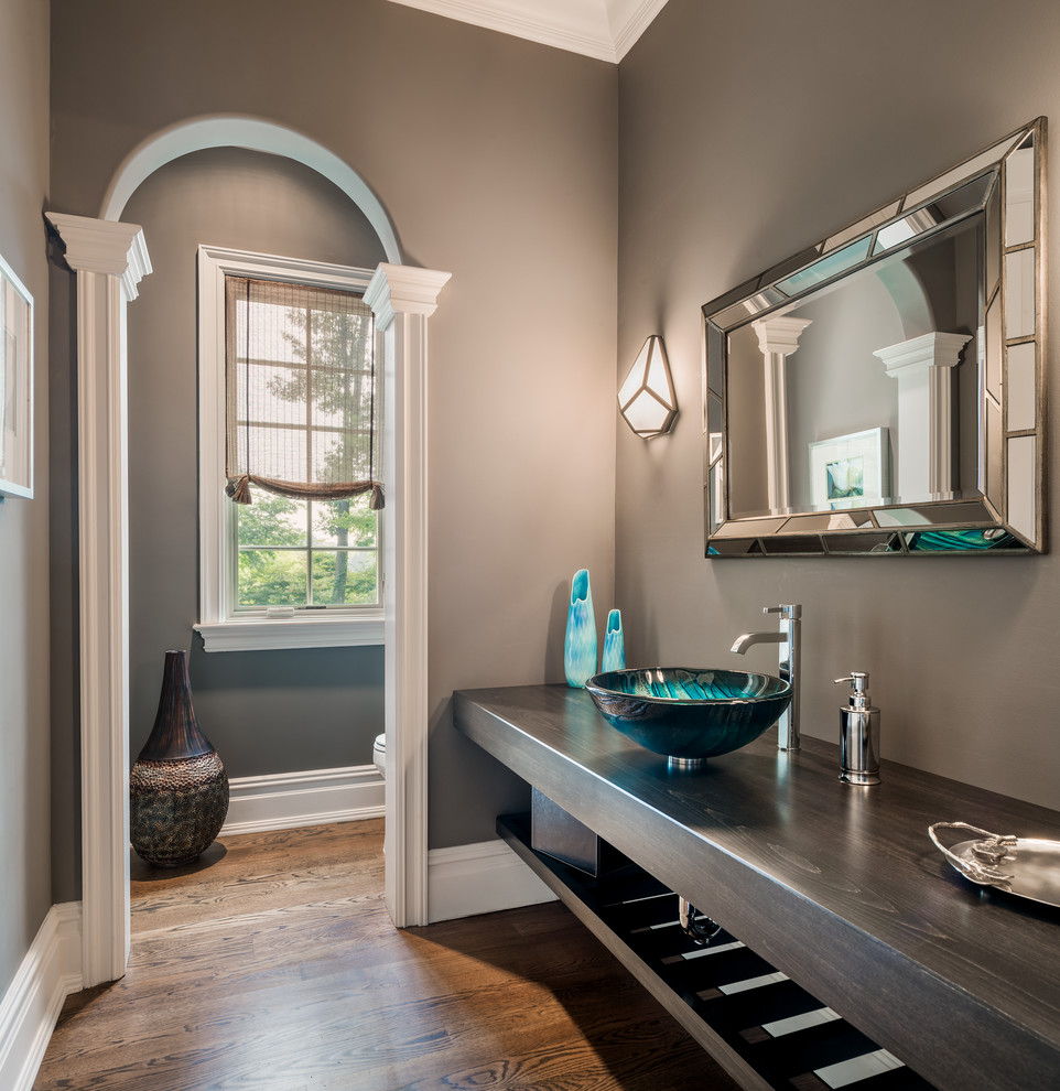 Inspiration for a medium sized traditional shower room bathroom in Philadelphia with open cabinets, a two-piece toilet, grey walls, medium hardwood flooring, a vessel sink and wooden worktops.