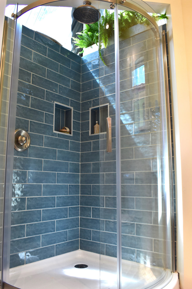 Photo of a small coastal shower room bathroom in Hawaii with a corner shower, blue tiles, ceramic tiles, a sliding door, a wall niche, a floating vanity unit and exposed beams.