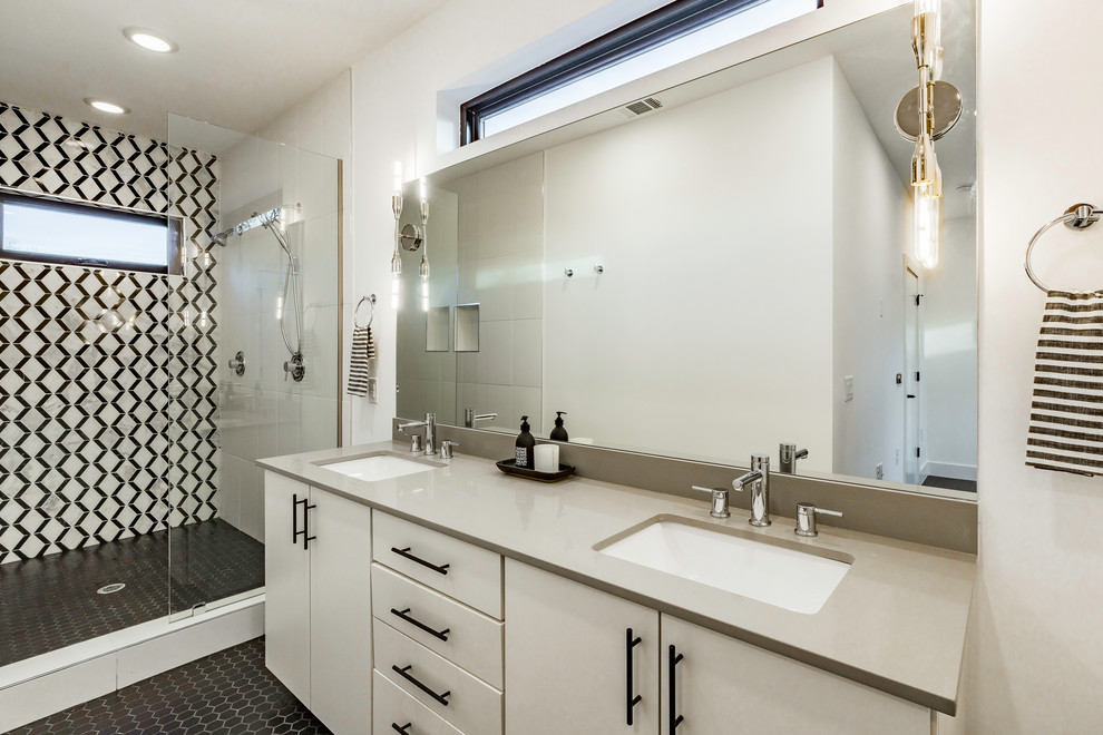 Photo of a medium sized modern ensuite bathroom in Austin with white walls, flat-panel cabinets, white cabinets, a double shower, black and white tiles, marble tiles, ceramic flooring, a submerged sink, engineered stone worktops, black floors and grey worktops.