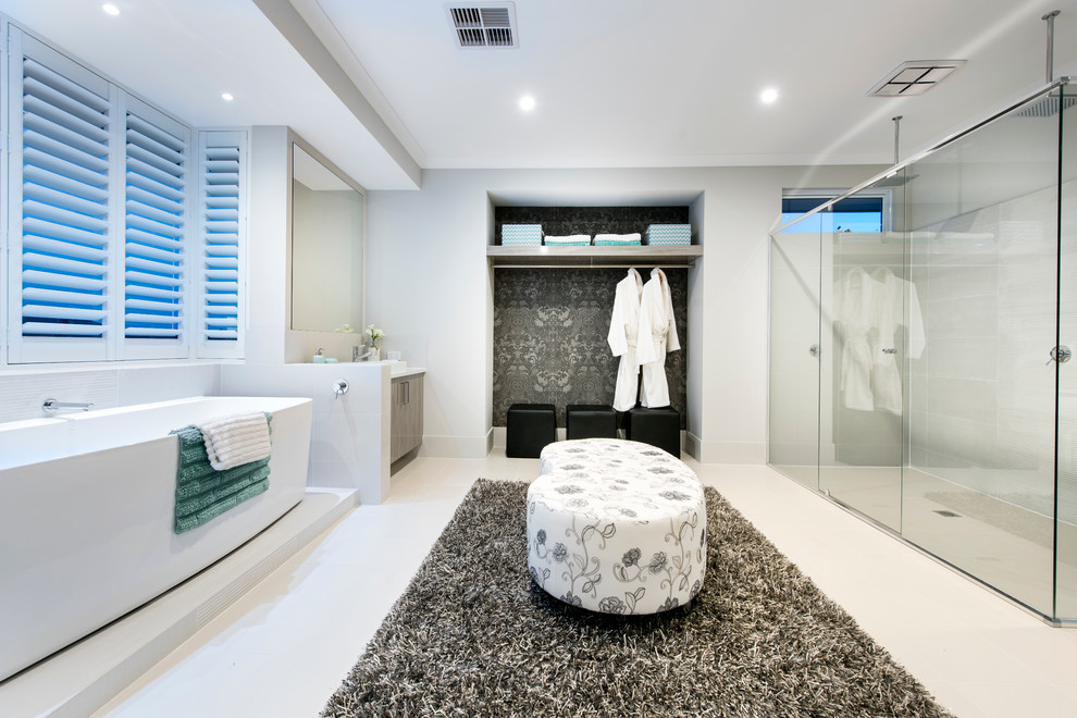 Design ideas for a contemporary bathroom in Perth with a vessel sink, grey cabinets, a freestanding bath, a corner shower, grey tiles and grey walls.