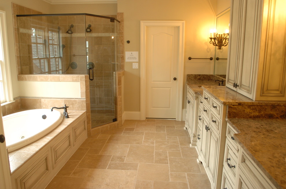 Example of a large classic master beige tile and stone tile travertine floor bathroom design in Atlanta with beige cabinets, marble countertops, beige walls, shaker cabinets and an undermount sink