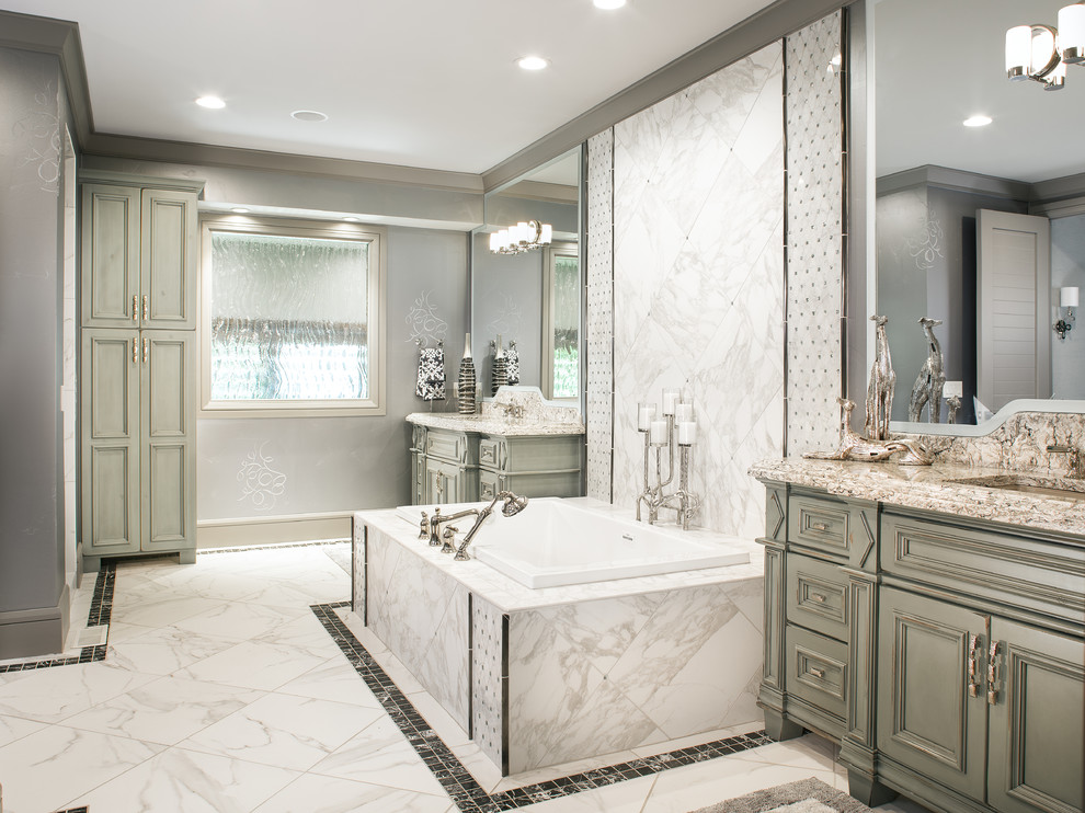 Inspiration for a timeless master white tile marble floor alcove shower remodel in Omaha with an undermount sink, recessed-panel cabinets, green cabinets, granite countertops, an undermount tub, a two-piece toilet and gray walls