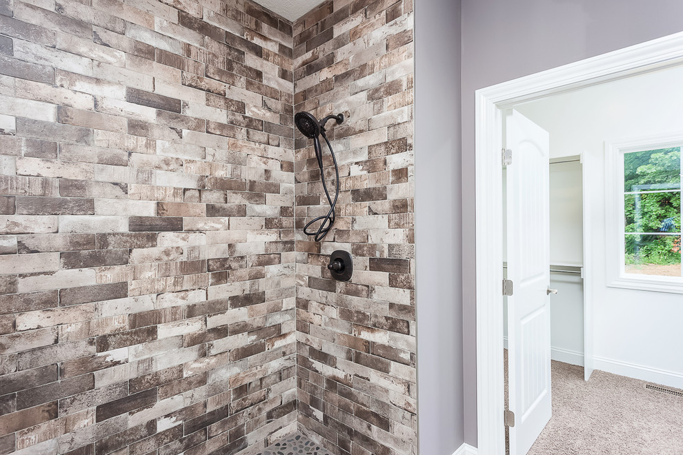 Example of a large transitional master gray tile and ceramic tile porcelain tile and brown floor bathroom design in Cleveland with shaker cabinets, white cabinets, a two-piece toilet, purple walls, an undermount sink and quartzite countertops
