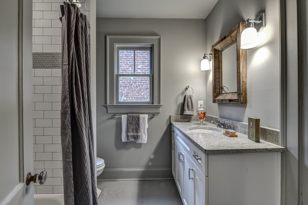 Bathroom - small traditional gray tile and ceramic tile ceramic tile bathroom idea in Atlanta with an undermount sink, shaker cabinets, white cabinets, granite countertops and gray walls