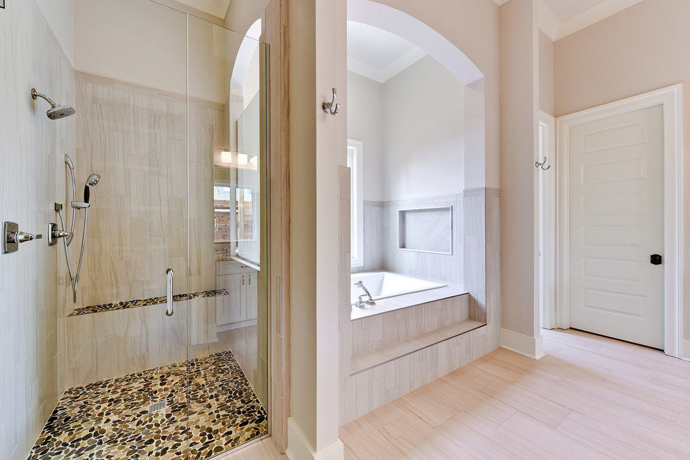 На фото: главная ванная комната среднего размера в стиле неоклассика (современная классика) с накладной ванной, угловым душем, унитазом-моноблоком, коричневой плиткой, керамогранитной плиткой, бежевыми стенами, полом из керамогранита, врезной раковиной, бежевым полом и душем с распашными дверями с