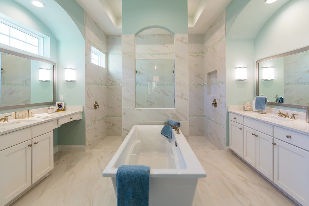 Photo of an expansive classic ensuite wet room bathroom in Jacksonville with a freestanding bath, white tiles, marble tiles and an open shower.
