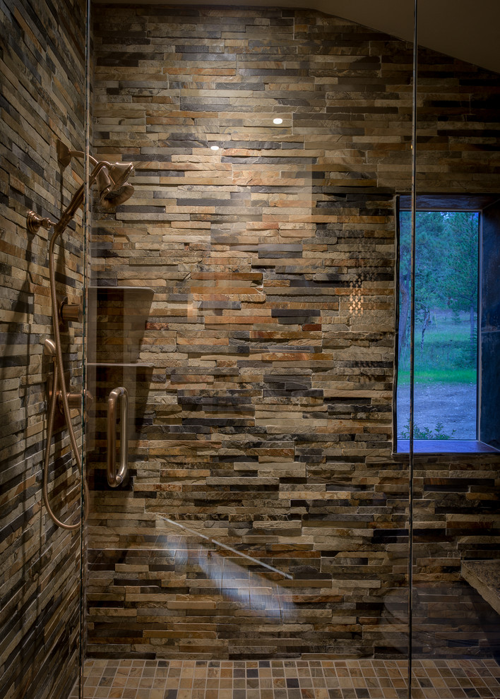 Example of a mid-sized mountain style 3/4 stone tile mosaic tile floor and multicolored floor alcove shower design in Denver with a hinged shower door