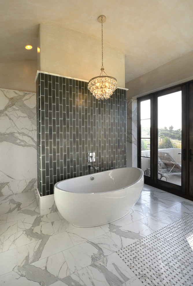 Expansive contemporary ensuite bathroom in San Francisco with raised-panel cabinets, dark wood cabinets, a freestanding bath, a walk-in shower, grey tiles, white tiles, mosaic tiles, beige walls, marble flooring, a submerged sink and marble worktops.