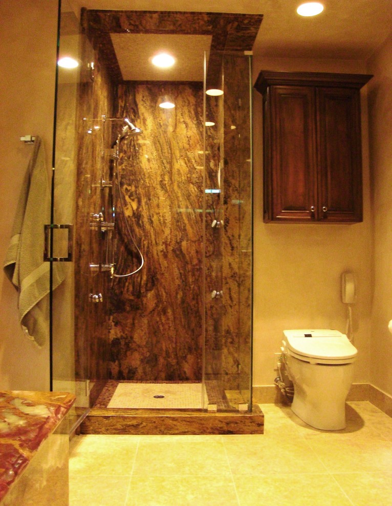 На фото: главная ванная комната среднего размера в современном стиле с фасадами с выступающей филенкой, темными деревянными фасадами, керамической плиткой, накладной ванной, угловым душем, биде, бежевыми стенами и полом из керамической плитки с