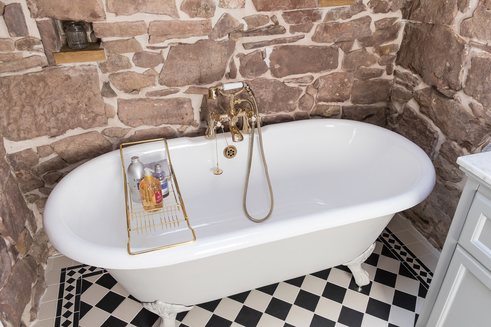 This is an example of a small victorian family bathroom in Other with freestanding cabinets, grey cabinets, a claw-foot bath, a shower/bath combination, a two-piece toilet, black and white tiles, porcelain tiles, grey walls, porcelain flooring, a submerged sink and marble worktops.